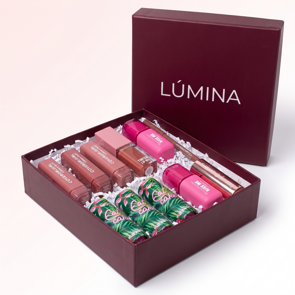 Caja Emprende Lúmina abierta con 10 productos reales de maquillaje surtidos